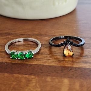 Size 7 rings, green and silver, orange and black.